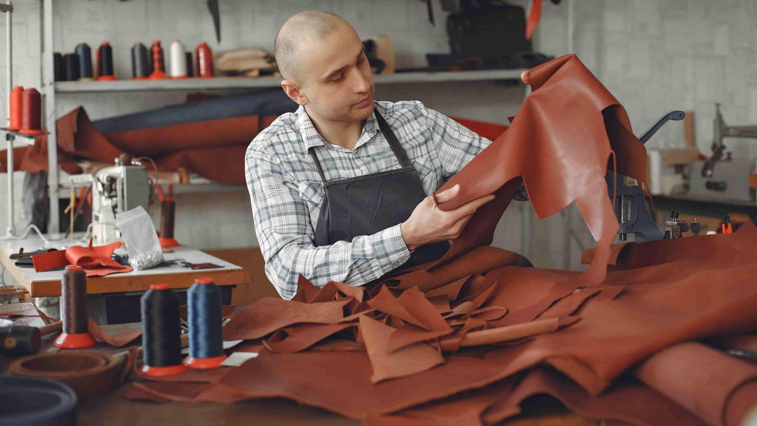 Leatherworker handling fine leather